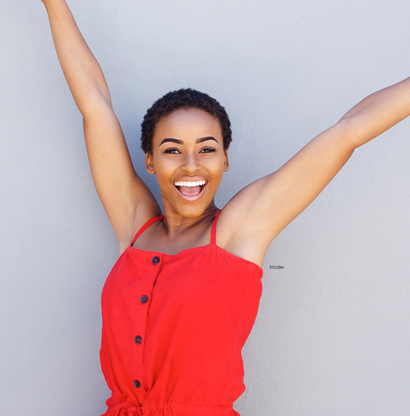 Woman with her arms raised